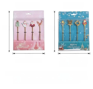 Detail of Christmas stainless steel dessert spoons and fruit forks in gift packaging