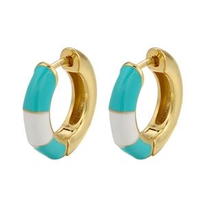 Detailed close-up of gold rectangular earrings with green and white enamel stripes