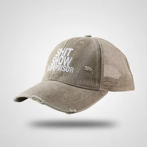 Close-up of vintage washed trucker hat featuring mesh back and distressed brim details