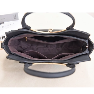 Top view showing the internal zipper pocket and spacious layout of the black tote bag