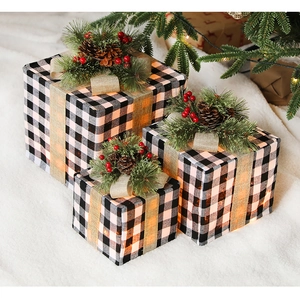 Three-piece black and white buffalo plaid Christmas gift boxes with pine cones and LED lights