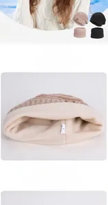 Close-up of thick white fleece lining in knitted winter beanie hat and neck warmer set
