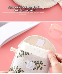 Detail of cloth sanitary napkin pouch featuring a green leaf pattern and Velcro closure