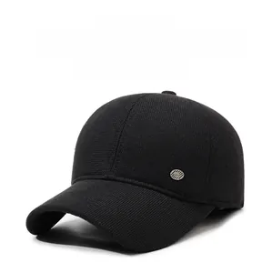 Detailed view of winter baseball cap texture with circular metal decorative buckle