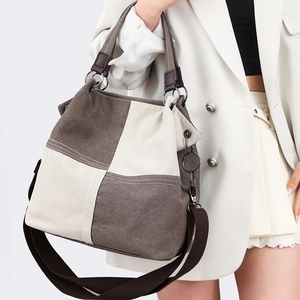 Minimalist canvas tote bag with brown patchwork design and adjustable shoulder strap