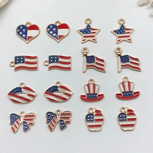 Macro view of 16 American flag enamel pendants in various shapes with gold plating