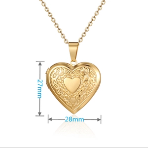 Macro shot of gold heart locket with vintage floral engraving and O-chain necklace