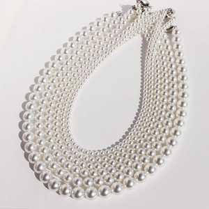 Classic multi-layer white pearl necklace with glossy finish and silver metal clasp