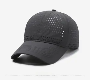 Detail of dark grey breathable baseball cap with laser-cut holes and white Narasan embroidery