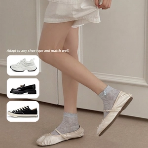 Grey lace mesh ankle socks with bow accent and ruffled cuffs shown with various shoes