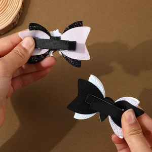 Halloween bow hair clips with black and white glitter finish and sturdy alligator clips
