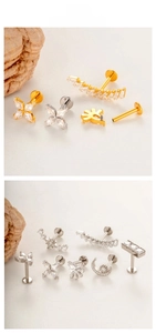 Detail of G23 titanium labret studs with zirconia in star, moon, and floral designs