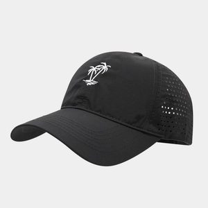 Detail of black baseball cap showing white palm tree embroidery and laser-cut vent holes
