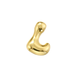 Macro shot of gold-plated fluid bubble charm with polished metallic finish for jewelry