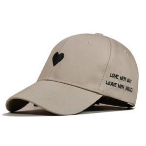 Detail showing 'Love Her But Leave Her Wild' embroidery on khaki cotton baseball cap