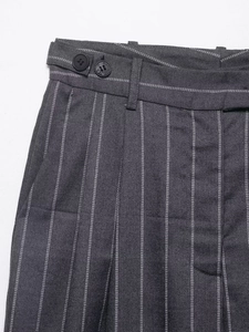 Detailed view of striped grey trousers featuring a double-button waist and white stitching