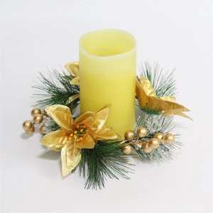 Golden Christmas wreath candle holder with frosted pine needles and festive floral accents