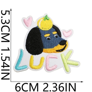 Close-up of dachshund embroidery patch with LUCK text showing detailed thread texture