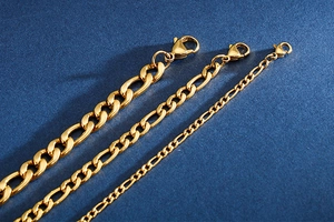 Three gold Figaro chain bracelets in various widths with secure lobster clasps
