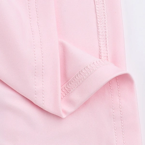 Close-up of elegant pale pink fabric showing premium 3D flower dress texture and stitching