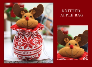 Detail of red knitted Christmas apple bag featuring a felt reindeer motif and drawstring