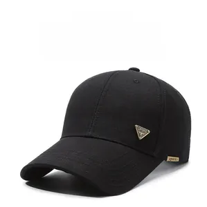 Close-up of black baseball cap with mesh texture and metal sport triangle emblem