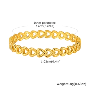 Detail view of gold openwork heart bangle with 17cm circumference and 1.02cm width