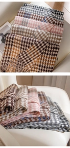 Detailed view of various houndstooth pattern scarves in diverse color options