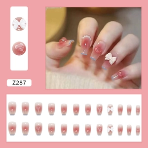 Pink gradient press-on nails with 3D bows and heart pearls, full 24-piece square set