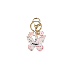 Détail du porte-clés papillon en acrylique avec motifs floraux et texte pour Nana