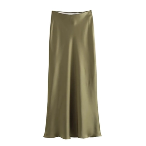 Detailed view of the olive green satin midi skirt showing silky texture and drape