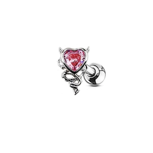 Piercing de ombligo corazón de diablo plateado con gema rosa y cuernos sobre fondo blanco