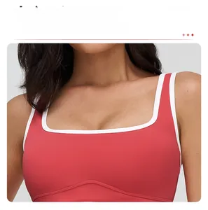 Close-up of red square neck sports bra with white contrast piping and elastic stitching
