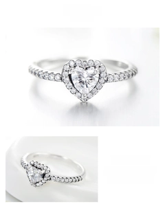 Macro detail of S925 sterling silver heart-shaped halo ring with pavé zircon accents