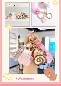 Detailed view of cute cat cake roll keychain with silicone strap and golden ring
