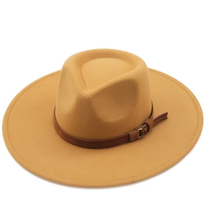 Fashionable wool fedora hat with a wide brim and decorative leather band in camel brown