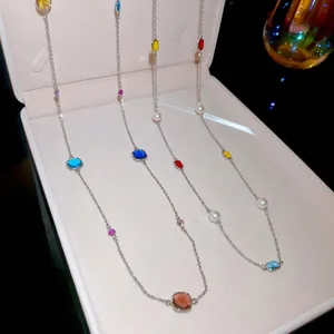 Colorful gemstone and pearl layered necklace with vibrant square-cut crystals and silver chain