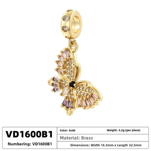 Detailed close-up of a gold-plated brass butterfly pendant with colorful zircons