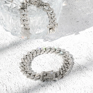 Silver-tone iced out Cuban link bracelet set with sparkling diamonds and box clasp