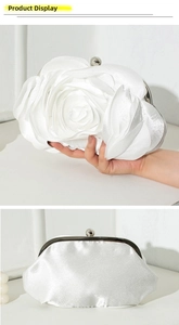 Detailed view of white satin rose evening clutch with petal texture and metal ball clasp