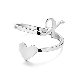 Detailed macro view of silver K-letter and heart adjustable open ring with polished finish