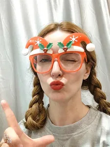 Christmas reindeer glasses frame with holiday patterns shown in real-life party wear