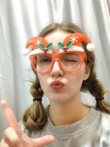 Christmas reindeer glasses frame with holiday patterns shown in real-life party wear