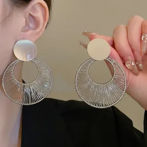 Silver hollow circular geometric drop earrings with detailed wire-wrapped design for women