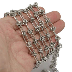 Chunky stainless steel knotted link chain bracelet with a polished silver metallic finish