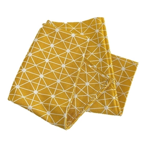 Ginger yellow cotton linen tablecloth with white geometric patterns for round tables