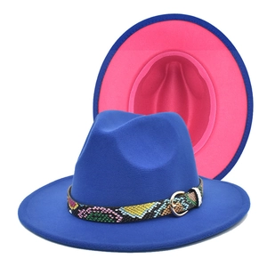 Two-tone royal blue fedora hat with pink interior and snakeskin patterned band
