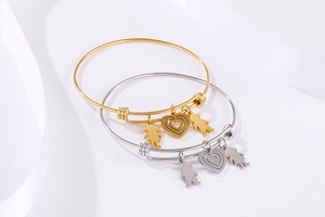 Detail view of adjustable steel wire bracelets with heart, boy and girl silhouette charms