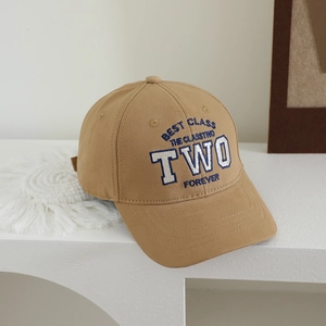 Close-up of khaki cotton baseball cap featuring TWO embroidery and collegiate style details