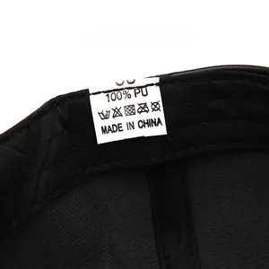 Detail of the 100% PU leather baseball cap interior featuring the size and care label
